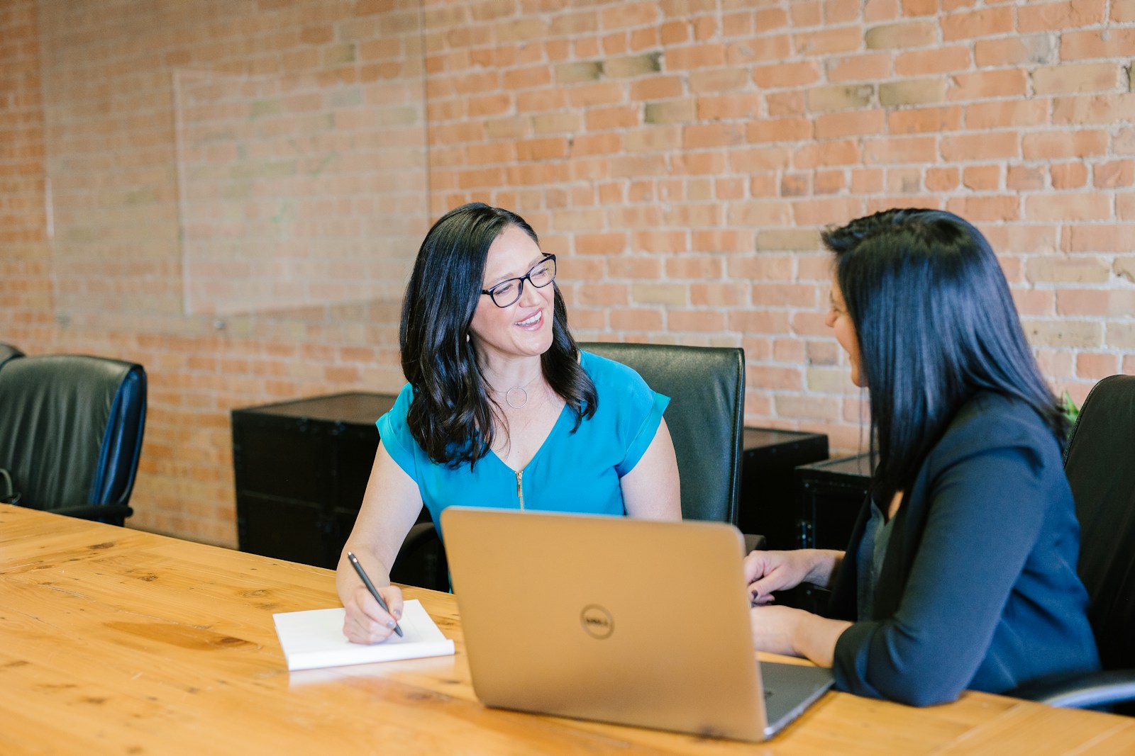 Colleagues discussing a project in an office